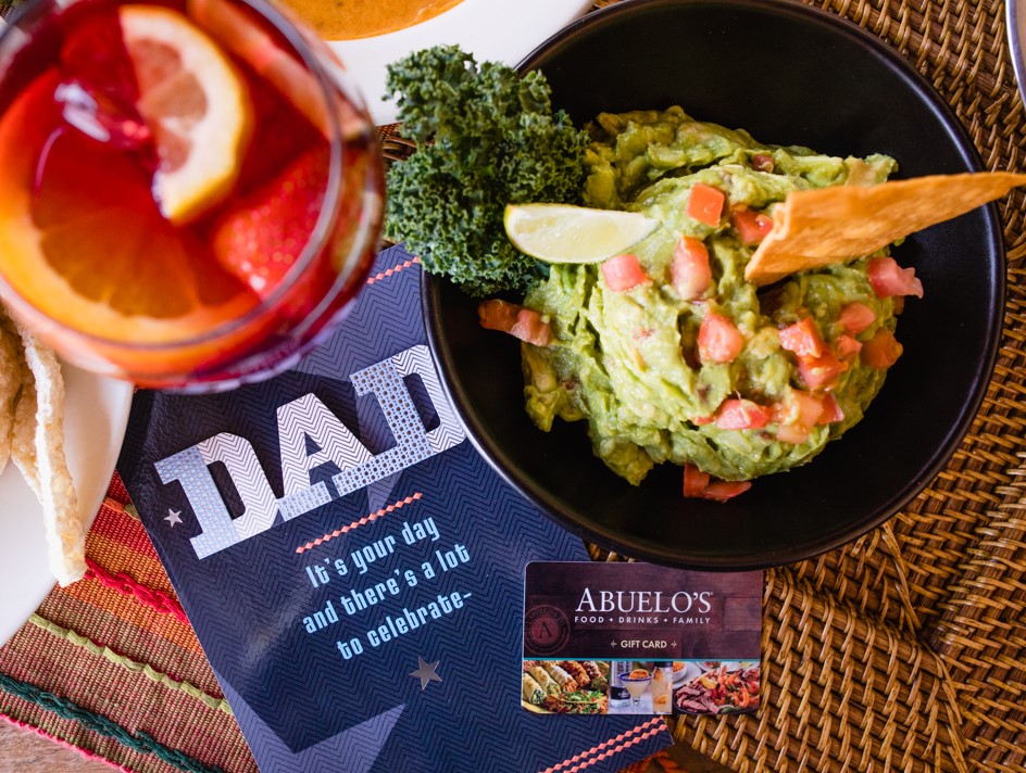 "Dad" gift card sat next to drink and bowl of guacamole